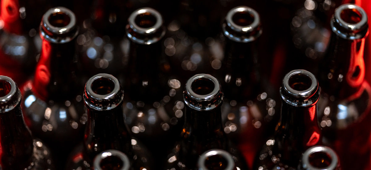 Crate of dark brown bottles