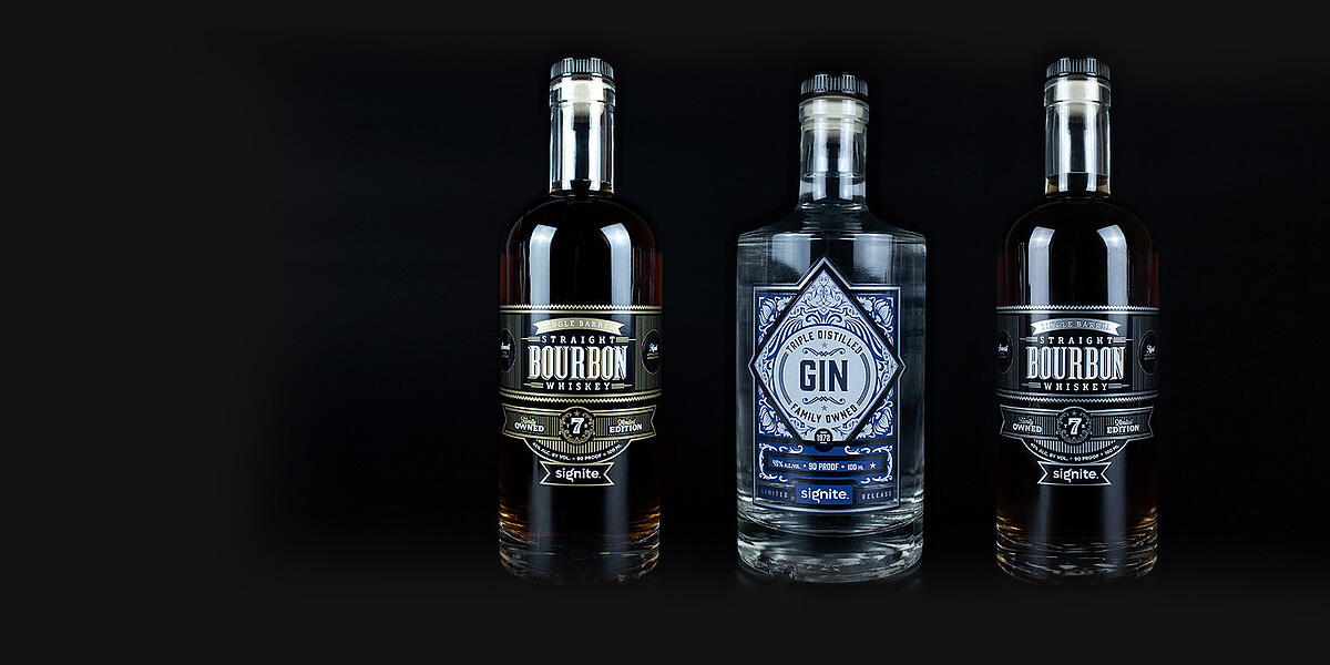 Sample of three bourbon, and gin bottle labels designed and printed using Signite
